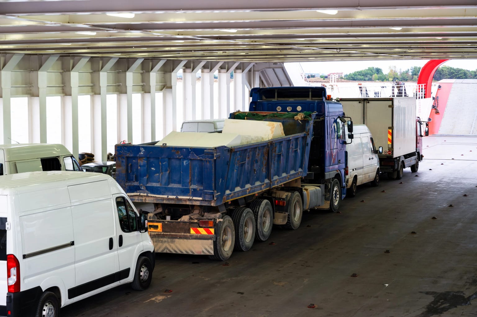 Trucks and vans lined up to board a ferry